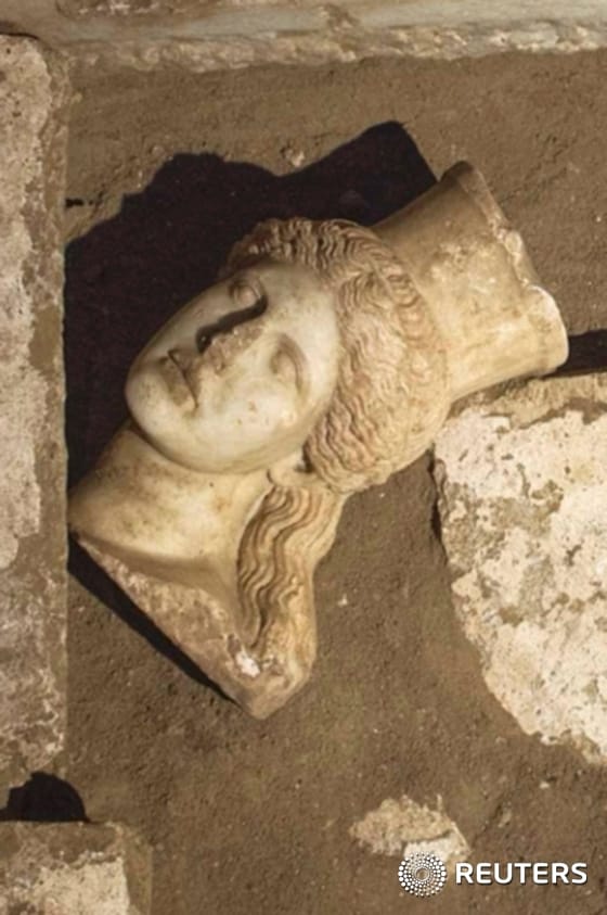 Handout photo shows the head of a sphinx seen inside a site of an archaelogical excavation at the town of Amphipolis