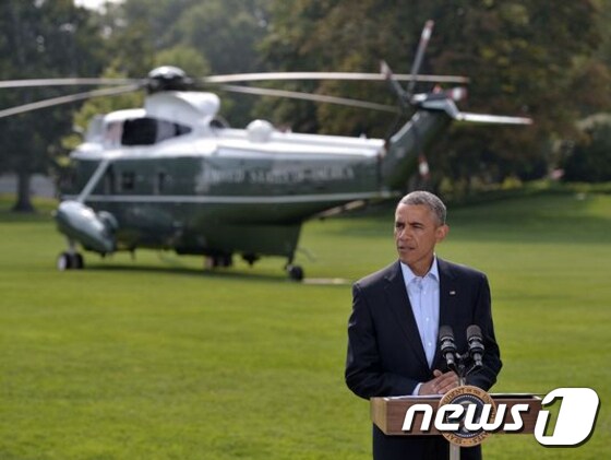 버락 오바마 미국 대통령이 9일(현지시간) 백악관에서 기자회견에서 이라크 문제에서 제한적인 군사개입을 할 것이라고 재차 강조했지만 지상군을 보낼 수밖에 없을 것이란 관측이 나오고 있다. © AFP=News1 