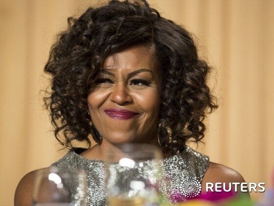 U.S. First Lady Michelle Obama reacts to the monologue by Saturday Night Live comedian Cecily Strong at the 2015 White House Correspondents’ Association Dinner