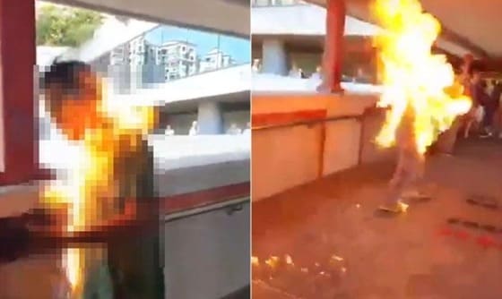 홍콩의 시위대가 친중인사의 몸에 불을 붙였다. - 트위터 갈무리