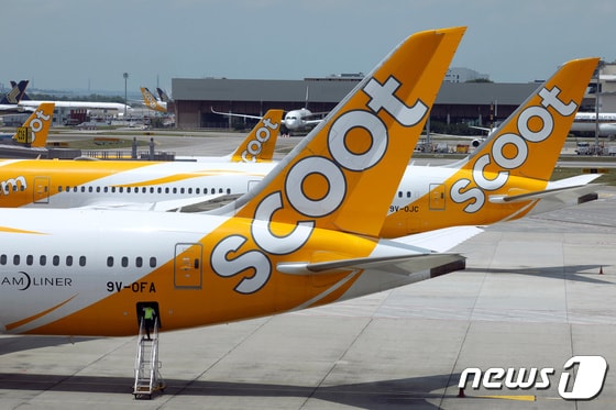 스쿠트항공 여객기가 싱가포르 창이공항에 착륙해 있다. 2023.3.30 © 로이터=뉴스1 © News1 강민경 기자