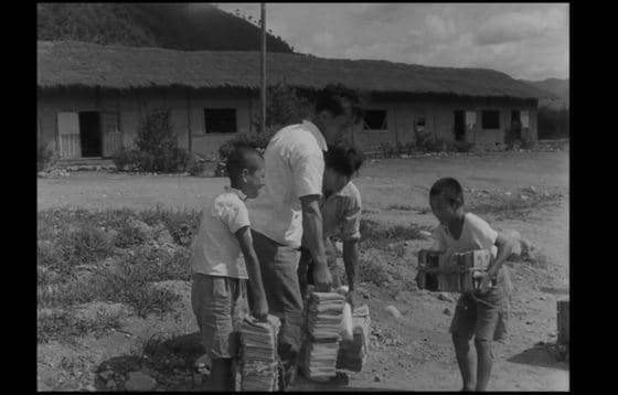  정전협정 발효일(1953.7.27.), 어린이들과 교사가 국어책을 이송하는 장면
