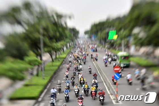 2020년 6월 베트남 남부 호찌민에서 시민들이 오토바이를 이용해 출근하는 모습(사진은 기사 내용과 무관함). 2020.6.29. © AFP=뉴스1 © News1 김성식 기자